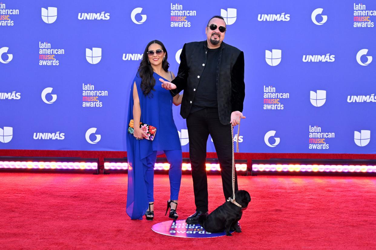 Aneliz Alvarez Alcala (L) and US singer Pepe Aguilar arrive for the 8th annual Latin American Music Awards at the MGM Grand Garden Arena in Las Vegas, Nevada, on April 20, 2023. (Photo by Robyn BECK / AFP) (Photo by ROBYN BECK/AFP via Getty Images)