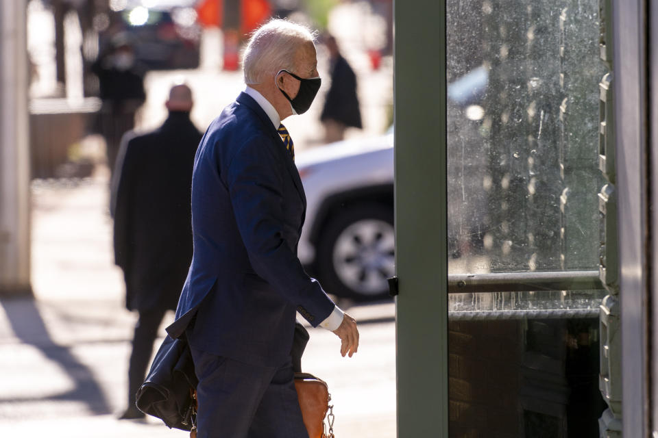 President-elect Joe Biden arrives at The Queen theater, Tuesday, Dec. 29, 2020, in Wilmington, Del. (AP Photo/Andrew Harnik)