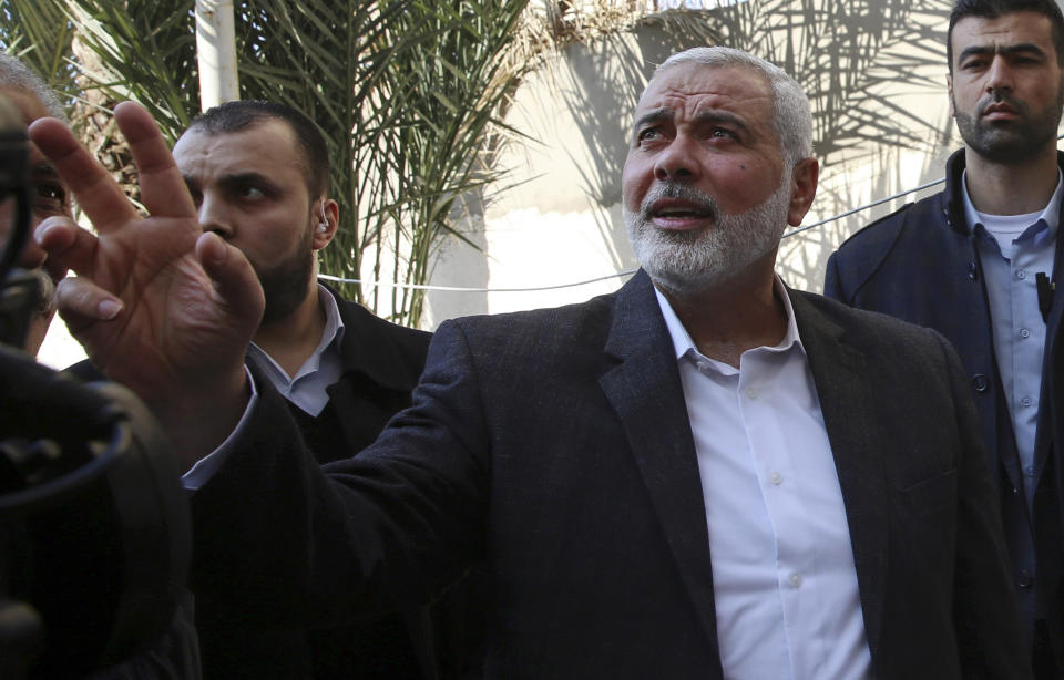 FILE - In this March 27, 2019 file photo, Hamas' supreme leader Ismail Haniyeh tours the site of a destroyed building, in Gaza City. Palestinian President Mahmoud Abbas has announced that the first presidential and parliamentary elections since 2006 will be held later in 2021. The voting is seen as a key step in mending a rift between Abbas’ Fatah party that rules the West Bank and the Islamic militant group Hamas that controls the Gaza Strip. ( (AP Photo/Adel Hana, File)