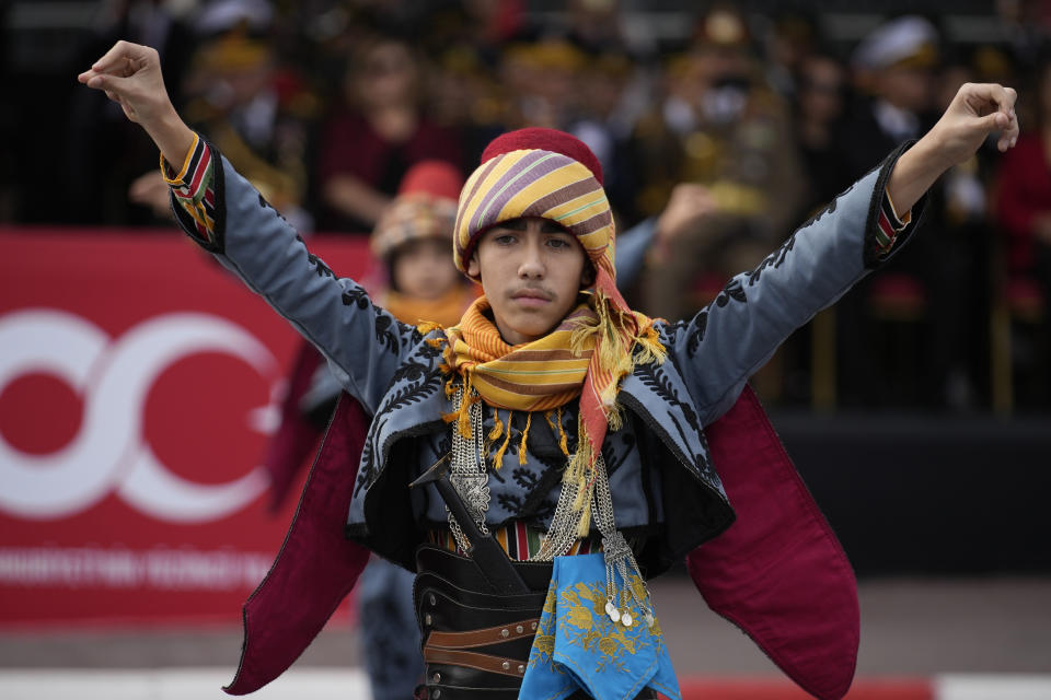 A man wearing Turkish traditional uniform, performs as part of celebrations marking the 100th anniversary of the creation of the modern, secular Turkish Republic, in Istanbul, Sunday, Oct. 29, 2023. (AP Photo/Emrah Gurel)