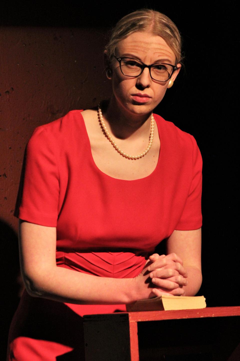 Mrs. Gottlieb (Gracie Ridings), the mother of the Dead Man, gives an audience member a sour look when a cellphone rings during a memorial service for her son.