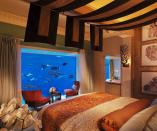 <p>Got cash to splash? Then book the fabulous, three-storey underwater suite at The Atlantis in Dubai, where you can sleep surrounded by thousands of sea creatures. The pad has enough room for five guests and features floor-to-ceiling lagoon views, so you really feel truly immersed in underwater life. From £2,943 per night. [Photo: The Atlantis] </p>