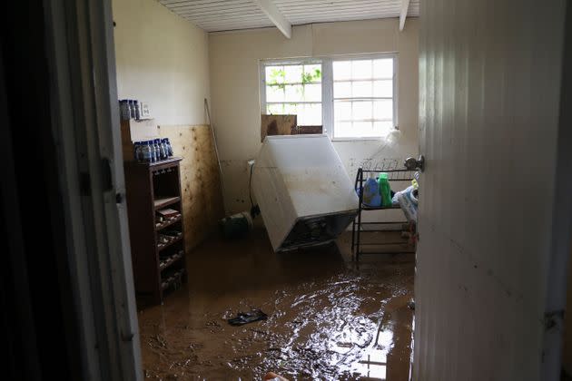 Mud covers the floor of a home flooded in Cayey, Puerto Rico, on Tuesday. (Photo: Stephanie Rojas via Associated Press)