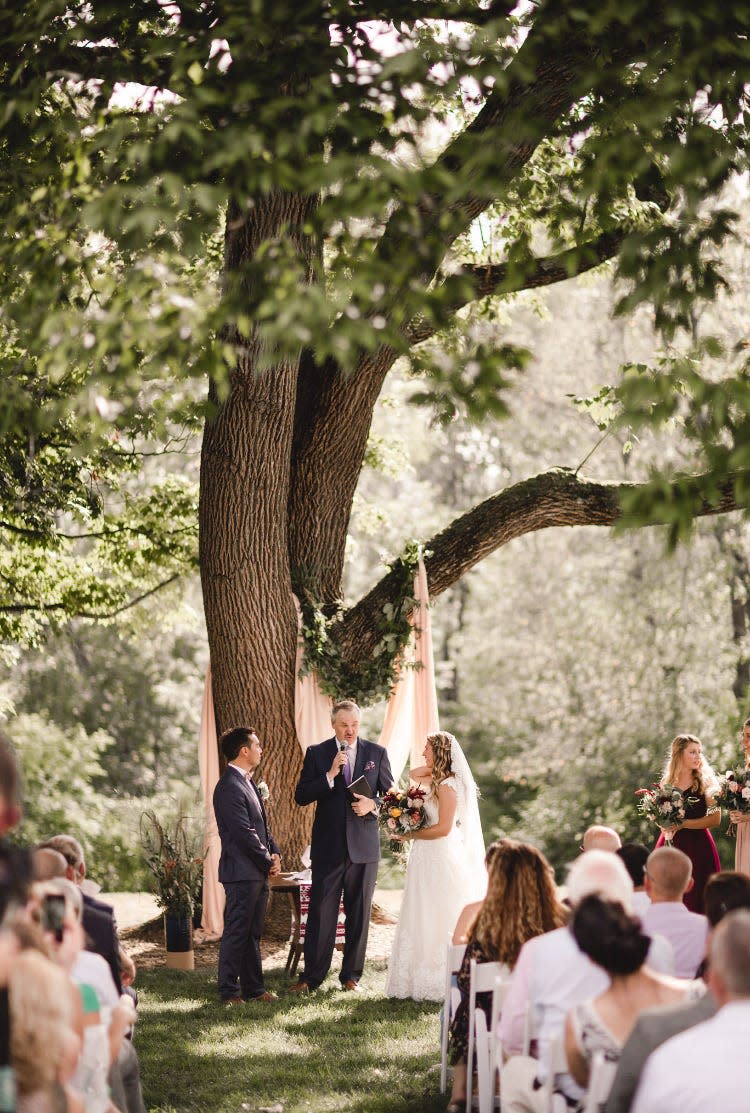 Like so many others, a couple take their vows beneath the wedding tree at the Tyson farm in Bedminster. The tree was taken down due to rot on May 29, 2024. “Yeah, I think when we got the bad news, my wife and daughter, Abby, cried a little,” said owner Scott Tyson.