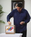 Venezuela's President Nicolas Maduro casts his vote at a polling station during a nationwide election for new mayors, in Caracas, Venezuela December 10, 2017. Miraflores Palace/Handout via REUTERS