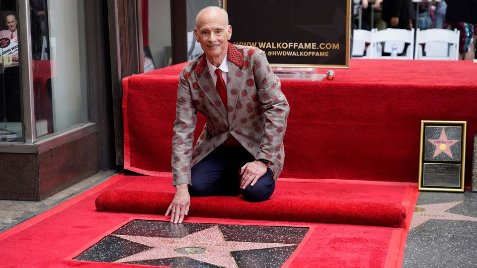 "My specialty is loving things that other people hate," Waters — pictured here with his star on the Hollywood Walk of Fame — told CNN. "If you've got a bad review or get arrested, I'll be the first person that will call you that day.” - Chris Pizzello/Invision/AP