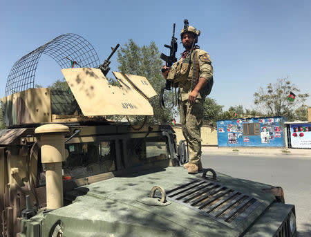 A member of the Afghan security forces keeps watch at the site of an attack in Kabul, Afghanistan August 21, 2018. REUTERS/Mohammad Ismail