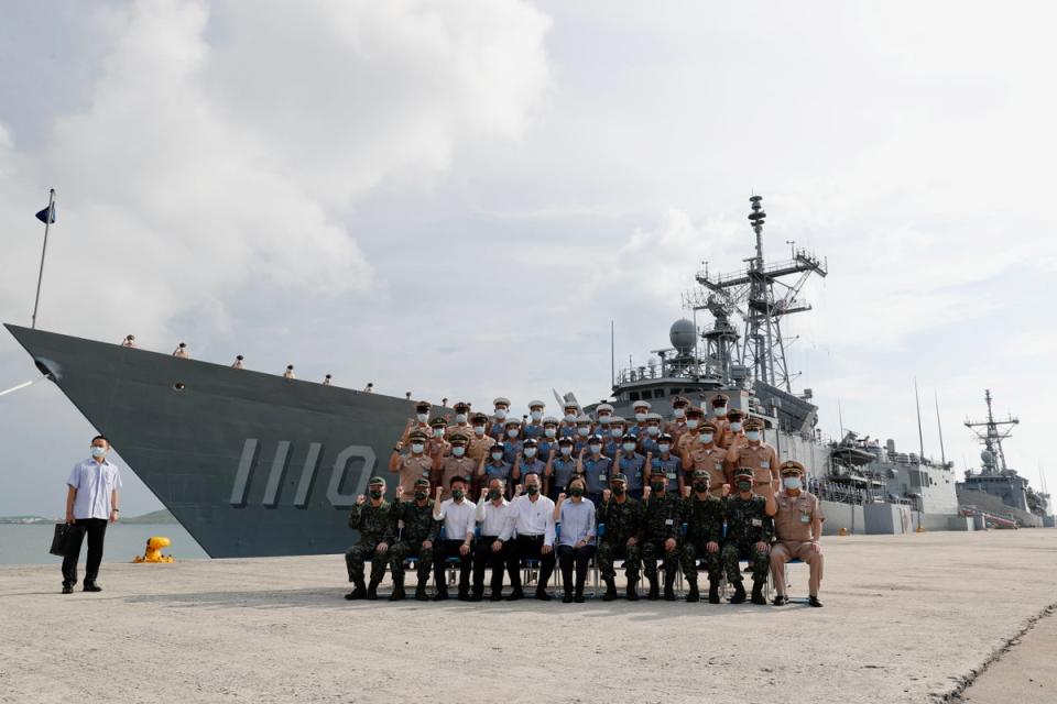 Taiwan’s president Tsai Ing-wen poses for a group photo with Navy officers during her visit to Penghu (EPA)