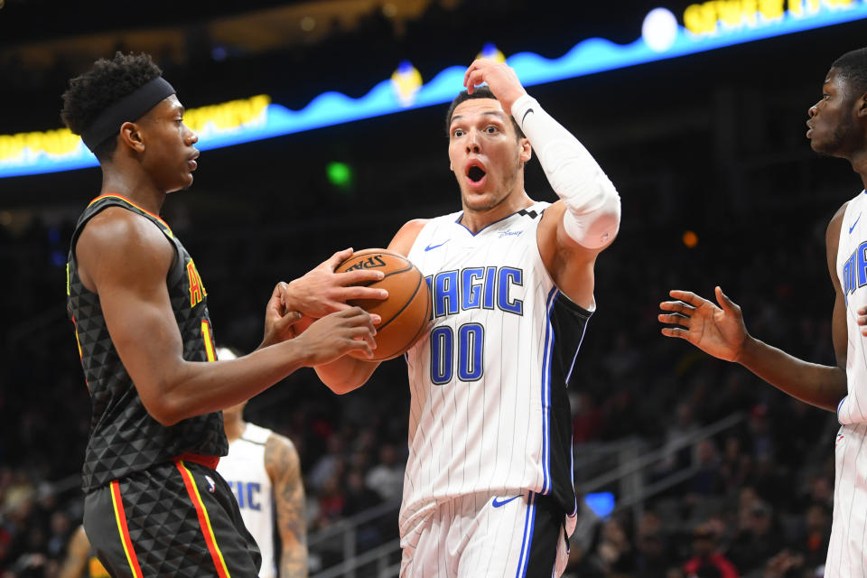 Orlando Magic forward Aaron Gordon (00) reacts after being called for a foul on Atlanta Hawks center Damian Jones, left, during the second half of an NBA basketball game Wednesday, Feb. 26, 2020, in Atlanta. Orlando won 130-120. (AP Photo/John Amis)