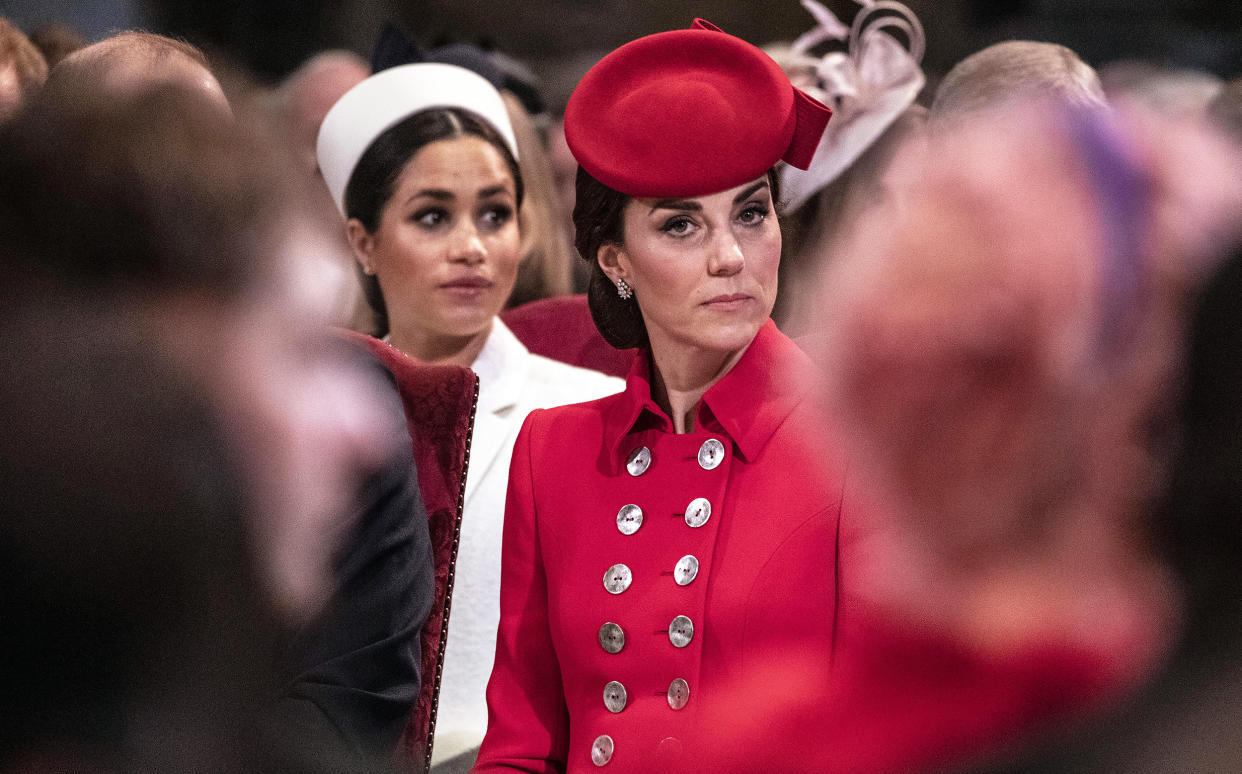 Catherine, The Duchess of Cambridge sits near Meghan, Duchess of Sussex. (Richard Pohle / Getty Images)