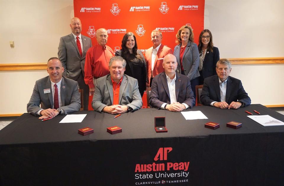 Representatives from Austin Peay State University and Legends Bank conduct a signing ceremony on May 24 on APSU's main campus to commemorate the Legends Bank Lecture Hall and Distinguished Professorship.