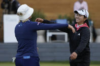 Rose Zhang, right, hugs Madelene Sagstrom, left, of Sweden, after winning the LPGA Cognizant Founders Cup golf tournament, Sunday, May 12, 2024, in Clifton, N.J. (AP Photo/Seth Wenig)
