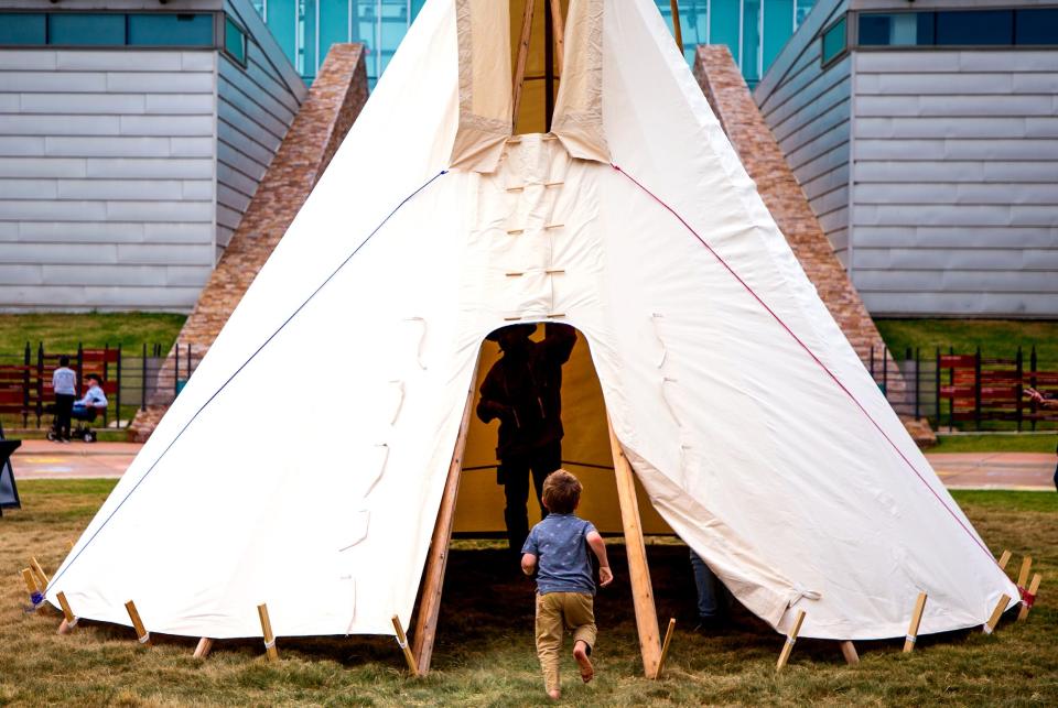 A child runs to see an exhibit during an Indigenous Peoples Day celebration Monday, Oct. 10, 2022, at the First Americans Museum in Oklahoma City.