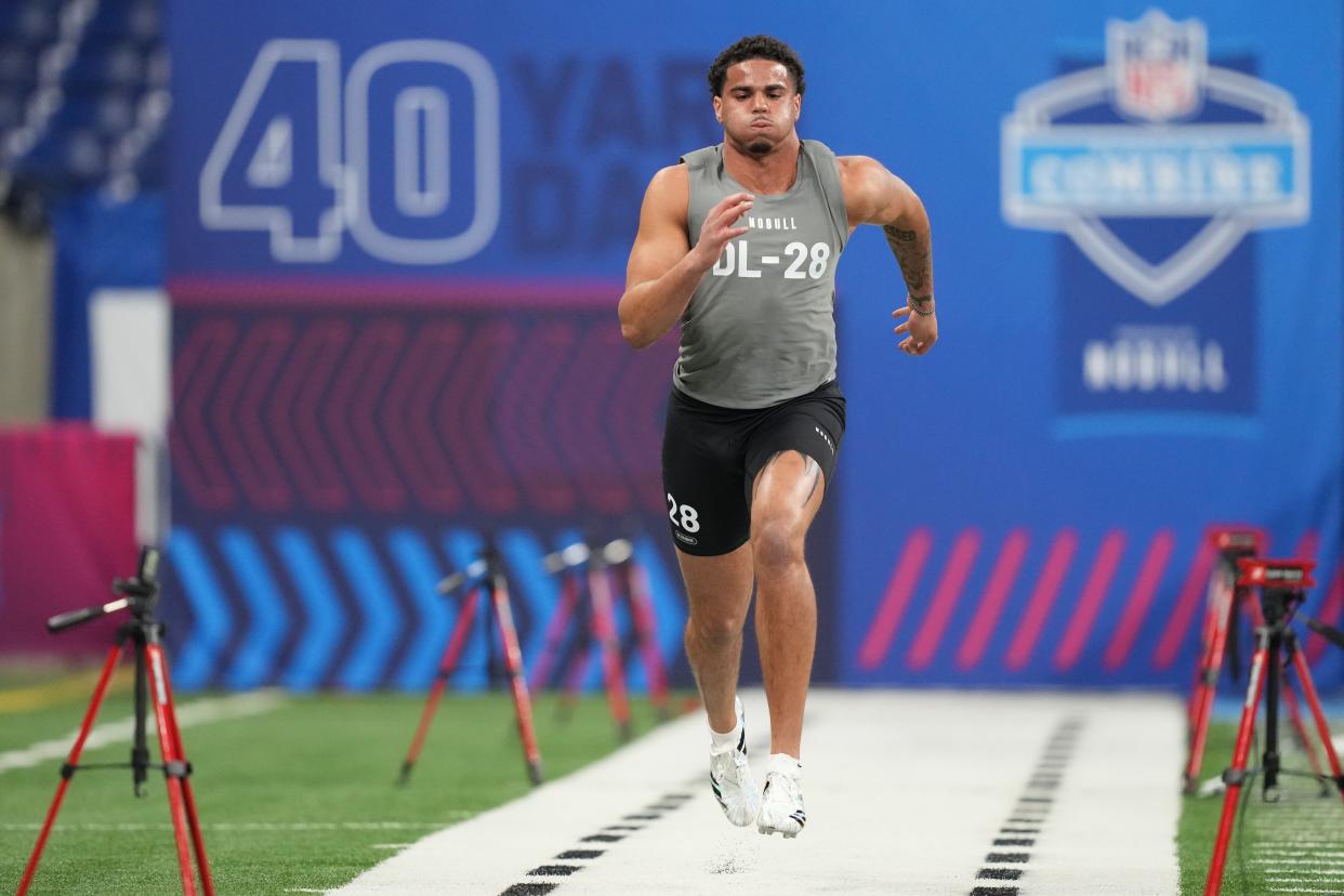 Kansas football defensive lineman Austin Booker works out during the 2024 NFL combine on Feb. 29, 2024 at Lucas Oil Stadium in Indianapolis.