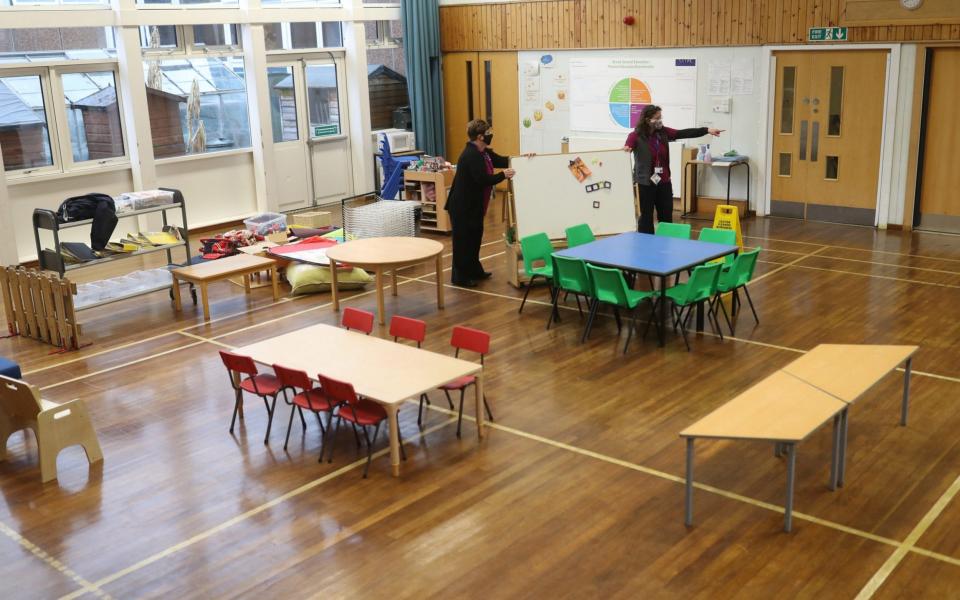 Staff make preparations for the return of pupils on Monday at Pitlochry High School in Scotland  - Reuters