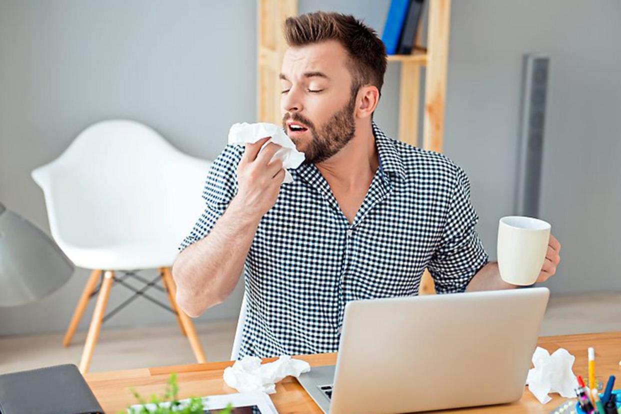 Not just a 'wimp': A man with flu: Shutterstock / Roman Samborskyi