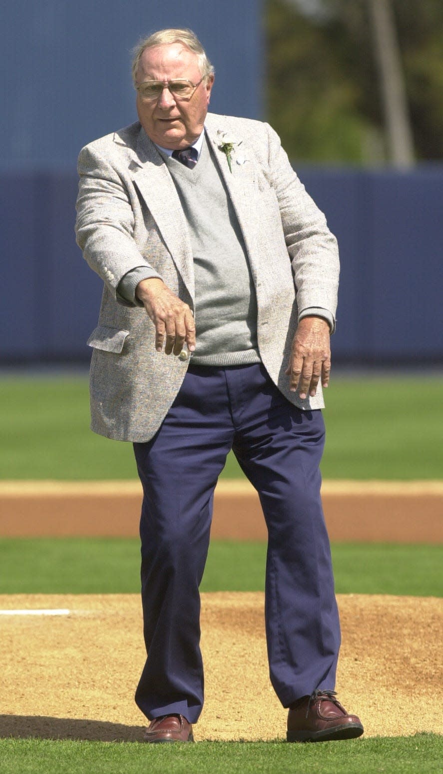 Lakeland City Commissioner Tom Shaw throws out the first pitch of spring training at Joker Marchant Stadium in February 2002.