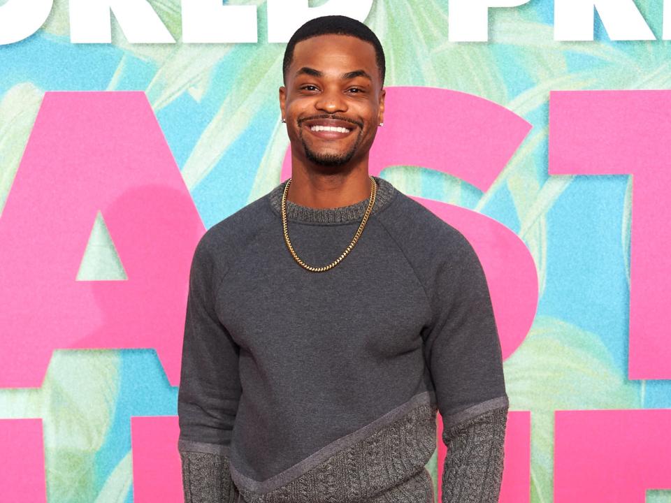 King Bach in a grey sweater