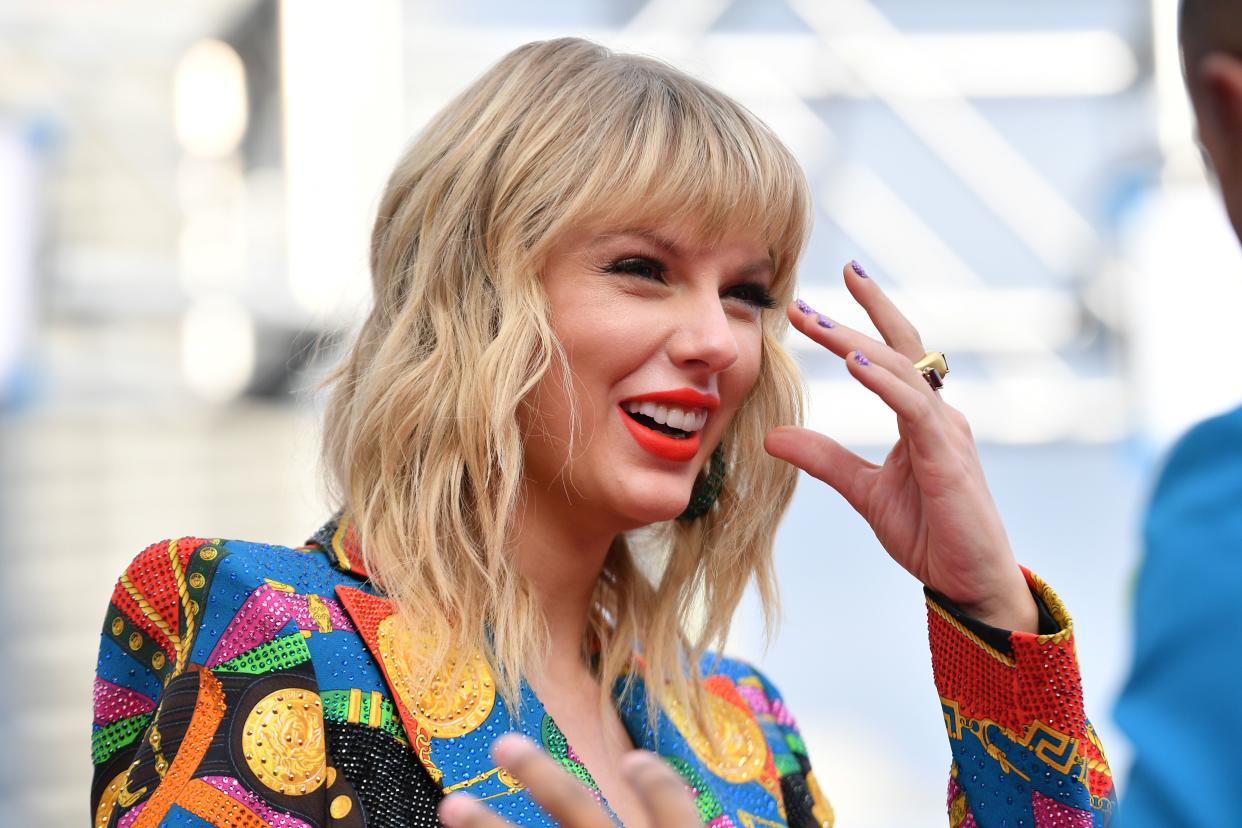 Taylor Swift smiles at an award show