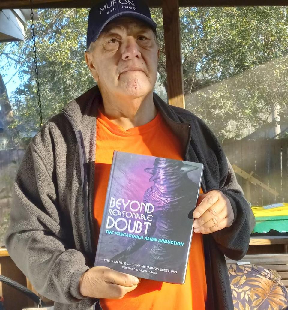 Calvin Parker holding a copy of Beyond Reasonable Doubt. He provided the forward to the book prior to his passing back in August.