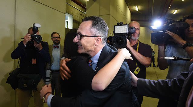 Greens leader Richard Di Natale embraces the protesters. Source: AAP