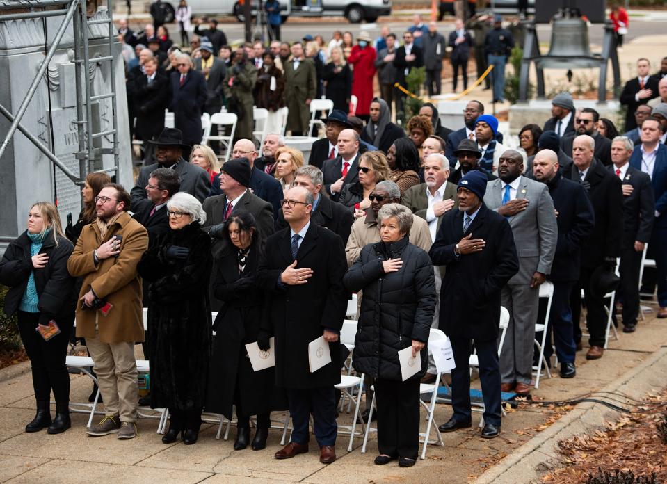 Attendees pledge allegiance during the inauguration of Gov. Tate Reeves at the Mississippi State Capitol in Jackson, Miss., on Tuesday, Jan. 9, 2024.