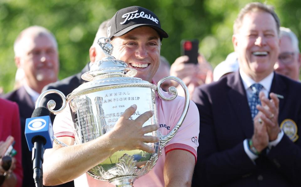 Justin Thomas of the United States celebrates with the Wanamaker Trophy after putting in to win on the 18th green, the third playoff hole during the final round of the 2022 PGA Championship at Southern Hills Country Club on May 22, 2022 in Tulsa, Oklahoma - Getty Images/Richard Heathcote