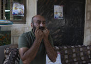 Palestinian Moayyad al-Alami, father of slain Mohammed al-Alami, 12, talks to reporters at the family house, in the West Bank village of Beit Ummar, near Hebron, Wednesday, Aug. 4, 2021. (AP Photo/Nasser Nasser)