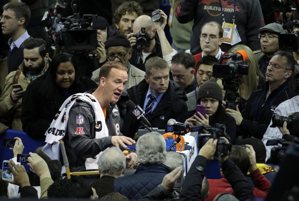 Denver Broncos' Peyton Manning answers questions during media day for the NFL Super Bowl XLVIII football game Tuesday, Jan. 28, 2014, in Newark, N.J. (AP Photo/Charlie Riedel)