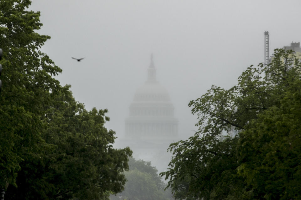 FILE - In this May 22, 2020, file photo the Dome of the U.S. Capitol Building is visible through heavy fog in Washington. New virus relief will have to wait until after the November election. Congress is past the point at which it can deliver more coronavirus aid soon, with differences between House Speaker Nancy Pelosi, Senate Republicans and President Donald Trump proving insurmountable. (AP Photo/Andrew Harnik, File)