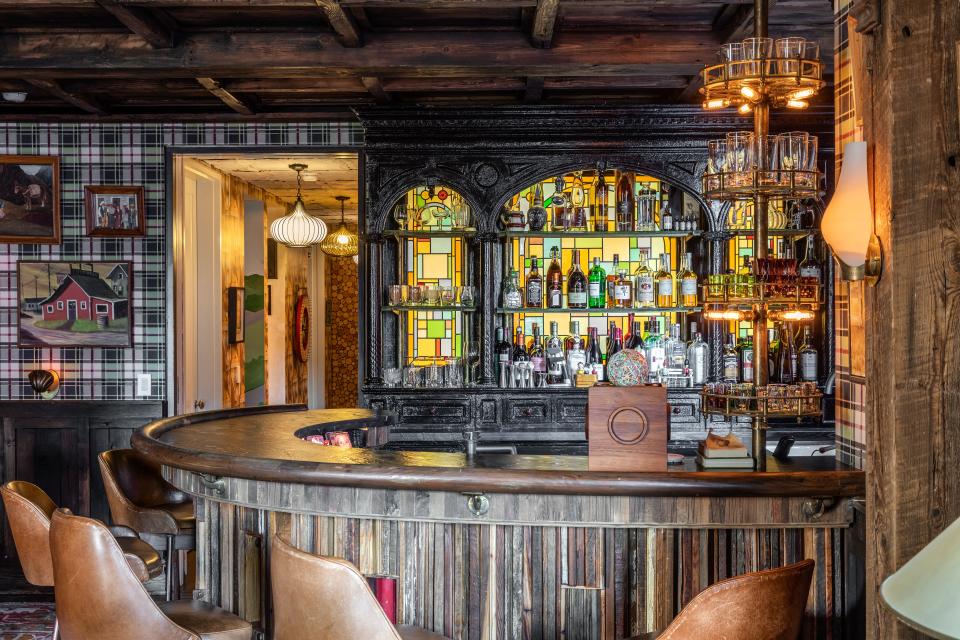 A vintage barback with custom inlaid stained glass in the “Saloon Room.”