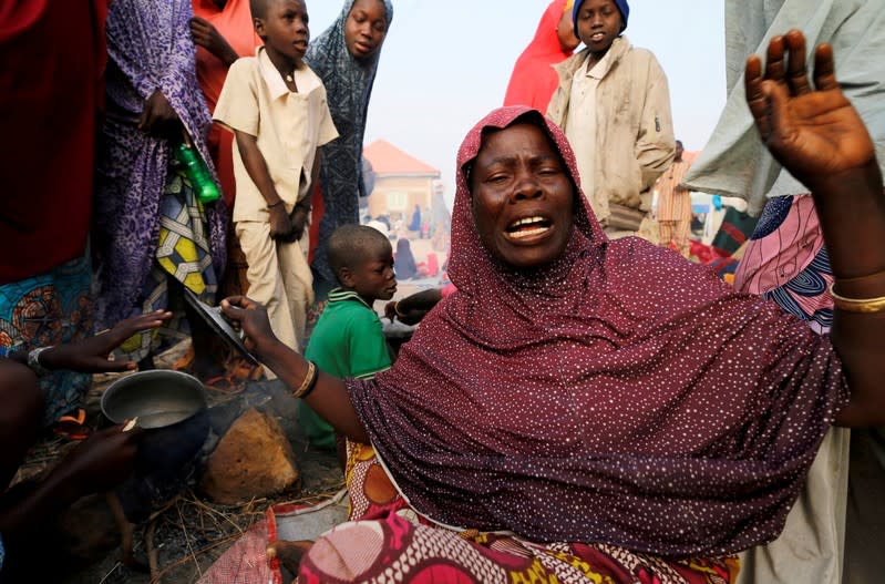 FILE PHOTO: An internally displaced woman prepares breakfast at the Teachers village camp in Maiduguri