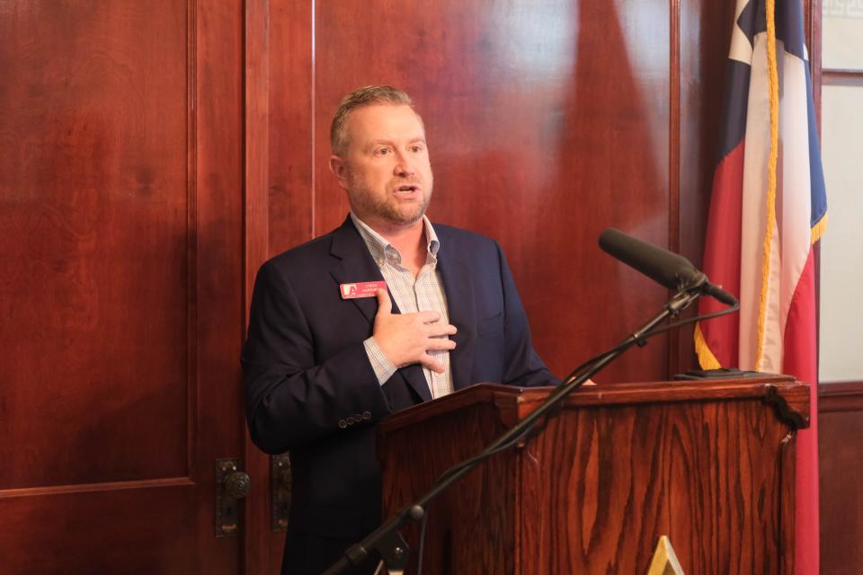 Jason Harrison, the president of the Amarillo Chamber of Commerce, congratulates Pantex Tuesday on becoming the largest employer in the Texas Panhandle.