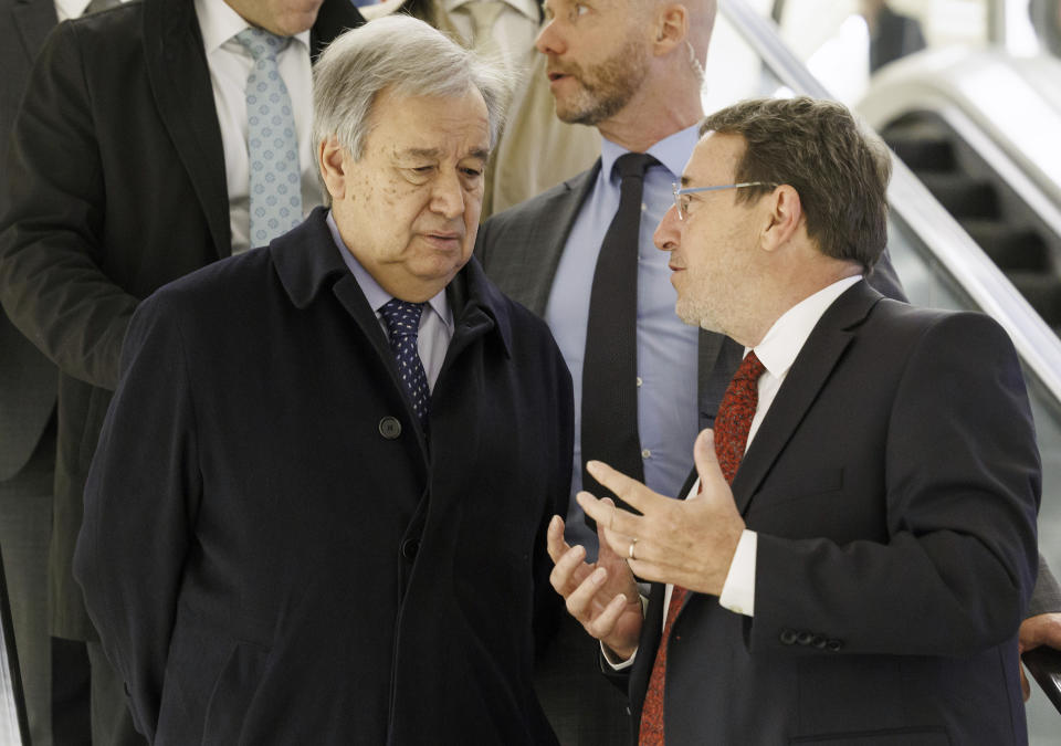 United Nations Development Programme (UNDP) administrator Achim Steiner, right, speaks to U.N. Secretary-General Antonio Guterres, as they leave a press stakeout, during the International Conference on Climate-Resilient Pakistan, at the European headquarters of the United Nation, in Geneva, Switzerland, Monday, Jan. 9, 2023. (Salvatore Di Nolfi/Keystone via AP)