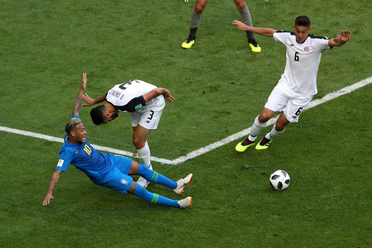 Neymar: A snap of him falling to the ground afterbeing brushed by a defender: REUTERS