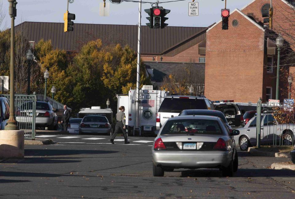 Law enforcement officers block access to Central Connecticut State University while it is in lockdown in New Britain, Connecticut November 4, 2013. A person has been taken into custody at Central Connecticut State University on Monday after officials locked down the campus when a suspicious person, possibly armed, was spotted, said New Britain Mayor Tim O'Brien. Citing students, local media said police had searched for a person who appeared to be carrying a gun and what looked like a sword. (REUTERS/Michelle McLoughlin)