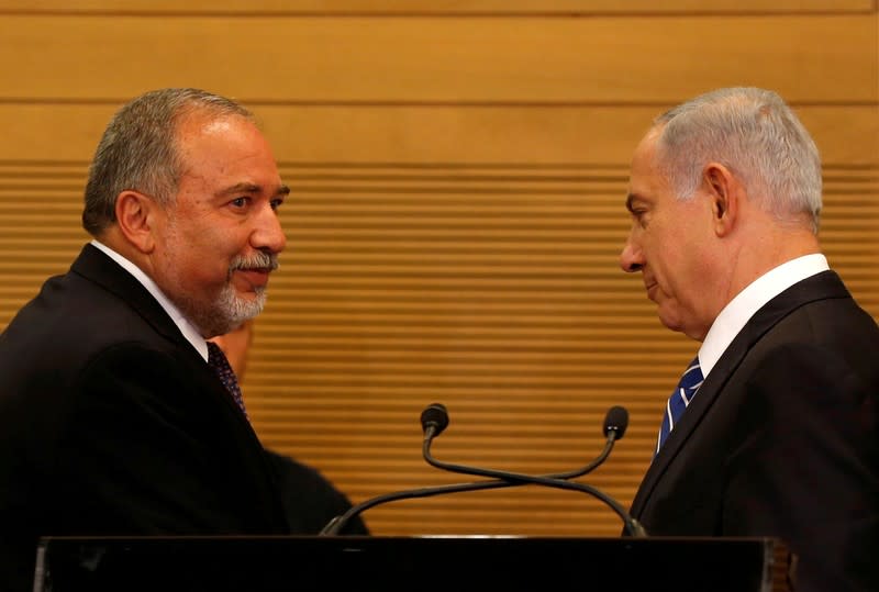 FILE PHOTO: Israeli prime minister Benjamin Netanyahu attends a media conference together with Israel's new Defence Minister Avigdor Lieberman, head of far-right Yisrael Beitenu party, following Lieberman's swearing-in ceremony at the Knesset, the Israeli