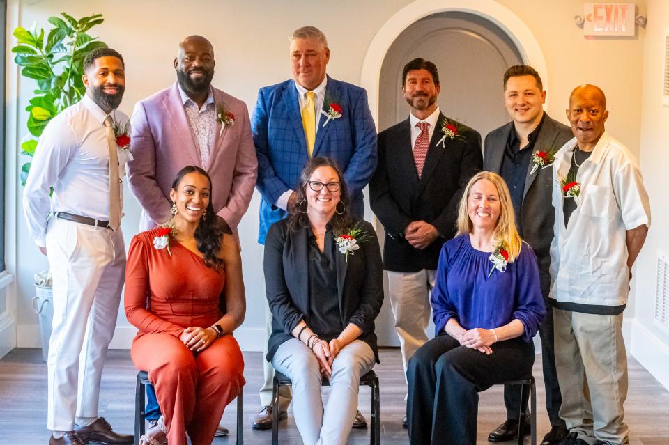 The 2024 New Bedford High School All Sport Hall of Fame Inductee's. (Sitting L-R) Stephanie Houtman Canery, Tracy E. Sedlack, Kara Tierney. (Standing L-R) Brian Eric Rudolph Jr., Jameson Barber, Dean Snell, Chris Norton, Ryan Goddu and Jason Baptiste.