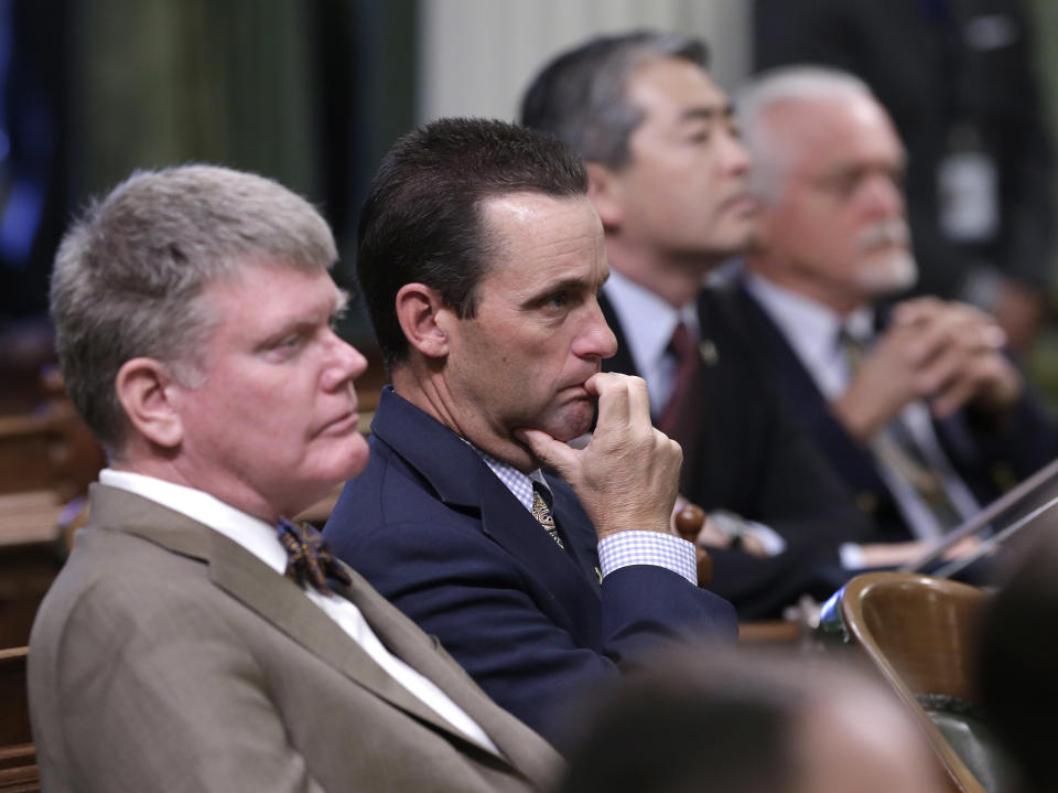 State Sen. Steve Knight, R-Palmdale, second from left, listens as Gov. Jerry Brown gave his annual State of the State address before a joint session of the Legislature at the Capitol in Sacramento, Calif., Wednesday, Jan. 22, 2014. Brown delivered a dual to lawmakers, that a California resurgence is well underway but is threatened by economic and environmental uncertainties.(AP Photo/Rich Pedroncelli)