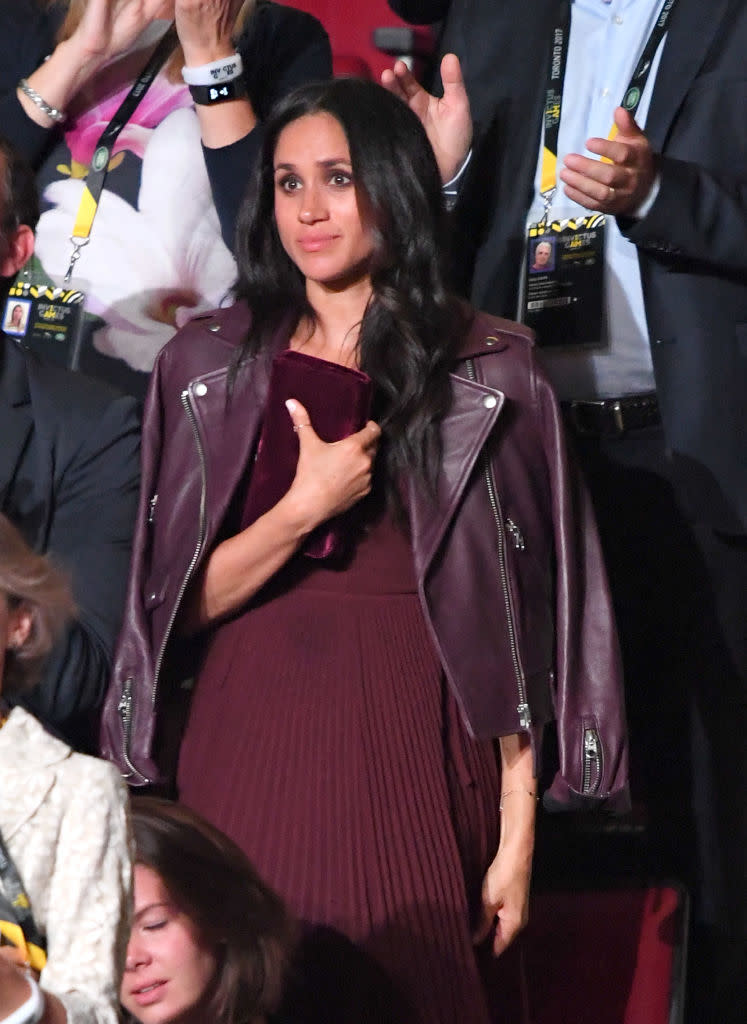 <p>Meghan’s burgundy look from the Invictus Games opening ceremony proved her love for her adopted nation of Canada. Wearing pieces by two Canadian labels, the potential royal-to-be also proved that she is following the Duchess of Cambridge in the ‘Kate effect’. Both her Mackage biker jacket and pleated Aritizia midi dress have already sold out.<br>[Photo: Getty] </p>