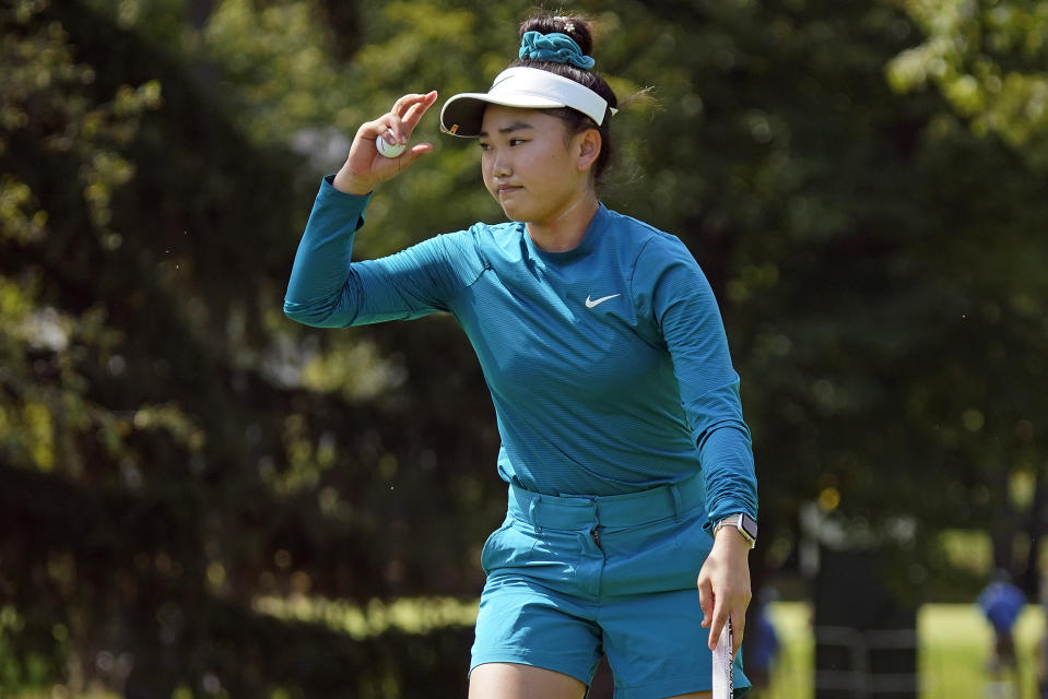 Lucy Li acknowledges the gallery after making a birdie putt on the sixth hole during the second round of the Dana Classic LPGA golf tournament Friday, Sept. 2, 2022, at the Highland Meadows Golf Club in Sylvania, Ohio. (AP Photo/Gene J. Puskar)