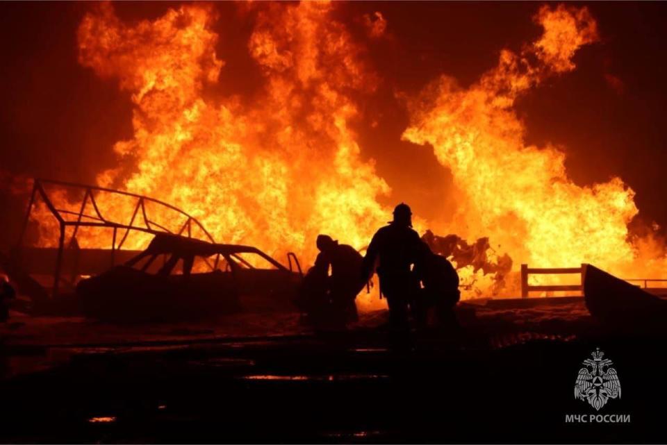 Firefighters continue to work at site after an explosion at a gas station in Makhachkala, Dagestan, Russia on August 15, 2023 / Credit: Anadolu Agency/Getty