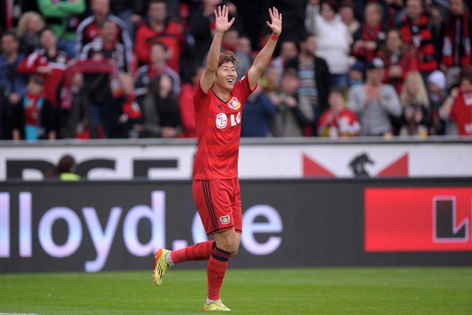 Leverkusen's Son Heung-min celebrates his 2-1 during the German Bundesliga soccer match between Bayer Leverkusen and Werder Bremen at BayArena in Leverkusen, Germany, Saturday May 10, 2014. (AP Photo/dpa,Marius Becker)