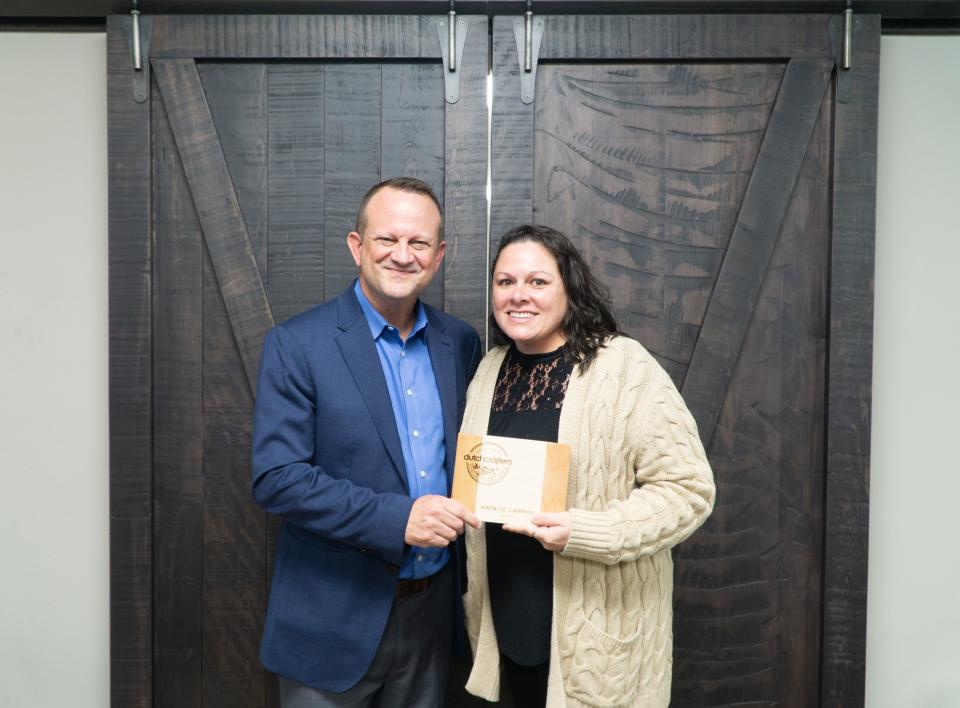 DutchCrafters CEO Jim Miller presents Natalie Campos with the Mortise and Tenon Award.