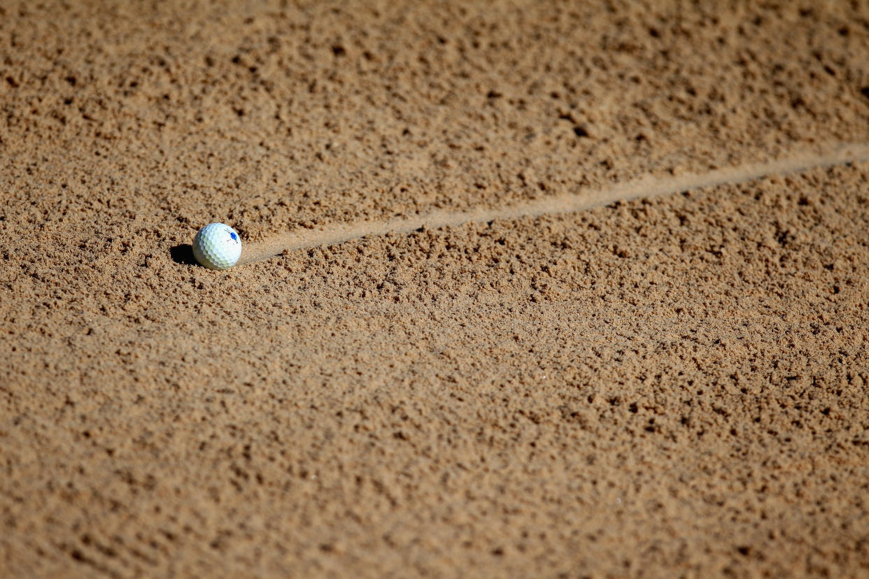 SAN ANTONIO, TX - MARCH 27: A ball is seen in the sand trap on the eighth hole during round two of the Valero Texas Open at TPC San Antonio AT&T Oaks Course on March 27, 2015 in San Antonio, Texas.  (Photo by Marianna Massey/Getty Images)