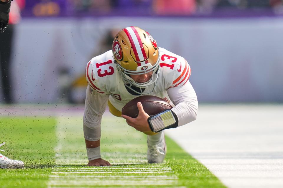 Sep 15, 2024; Minneapolis, Minnesota, USA; San Francisco 49ers quarterback Brock Purdy (13) dives against the Minnesota Vikings in the third quarter at U.S. Bank Stadium. Mandatory Credit: Brad Rempel-Imagn Images