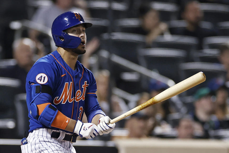 New York Mets' Michael Conforto watches his two-run home run against the Miami Marlins during the fourth inning of the second baseball game of a doubleheader Tuesday, Aug. 31, 2021, in New York. (AP Photo/Adam Hunger)