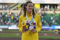 Silver medalist Yaroslava Mahuchikh, of Ukraine, poses on the podium after the women's high jump final at the World Athletics Championships on Tuesday, July 19, 2022, in Eugene, Ore. (AP Photo/Gregory Bull)