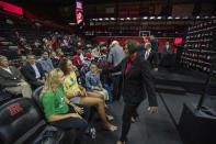 Notre Dame basketball players Dara Mabrey and Natalija Marshall attend a news conference to introduce their former coach, Coquese Washington, right, as the new women's basketball coach at Rutgers on Tuesday, May 24, 2022 in Piscataway, N.J. Washington was the associate head coach at Notre Dame for two seasons before being hired by Rutgers this week. (Andrew Mills/NJ Advance Media via AP)