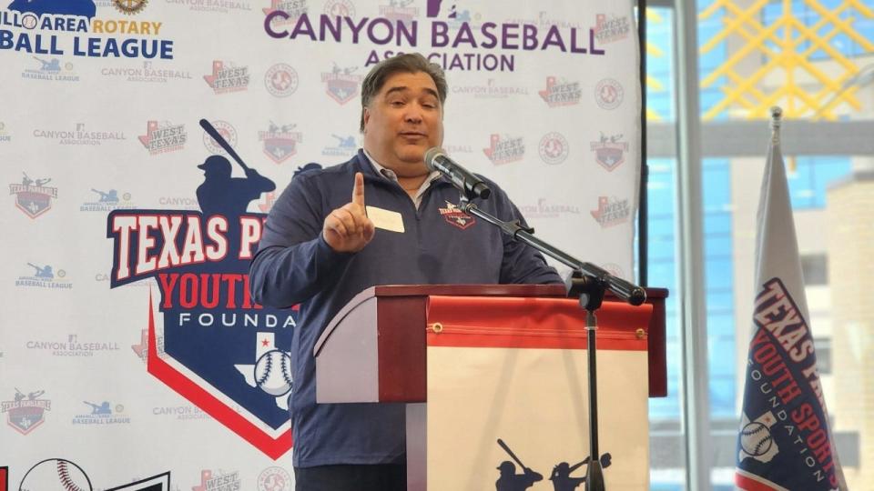 Jason Herrick, a board member for the Texas Panhandle Youth Sports Foundation, speaks at an event Wednesday at Hodgetown where his organization donated $125,000 to Kids Inc. toward their new multisport facility.